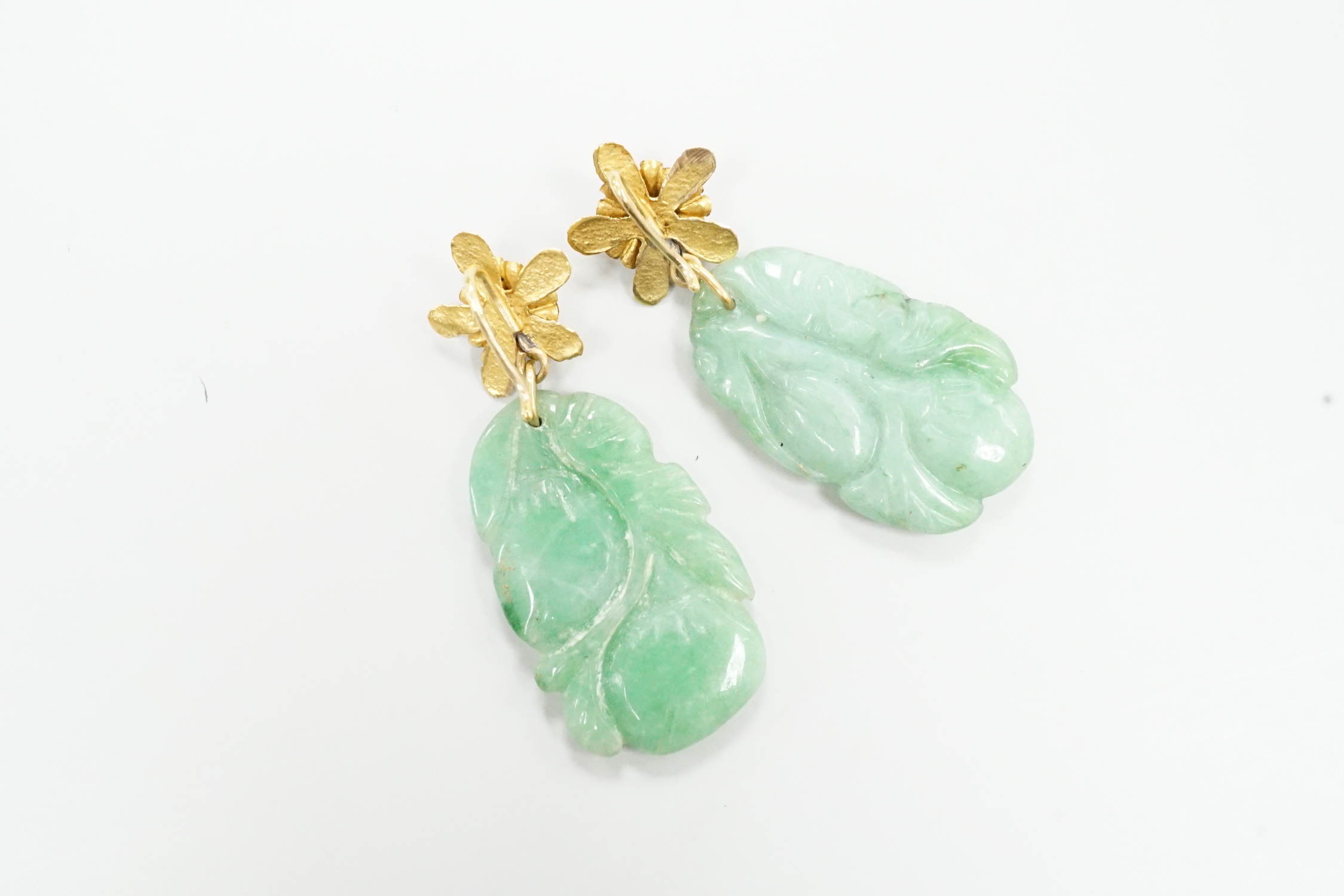 A pair of yellow metal and carved jade earrings, jade 30mm.